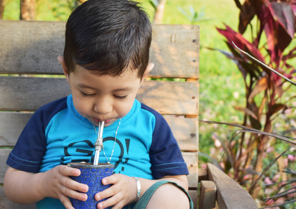 A youngster enjoying some tereré