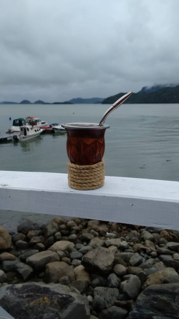 Enjoying a delicious mate by the water